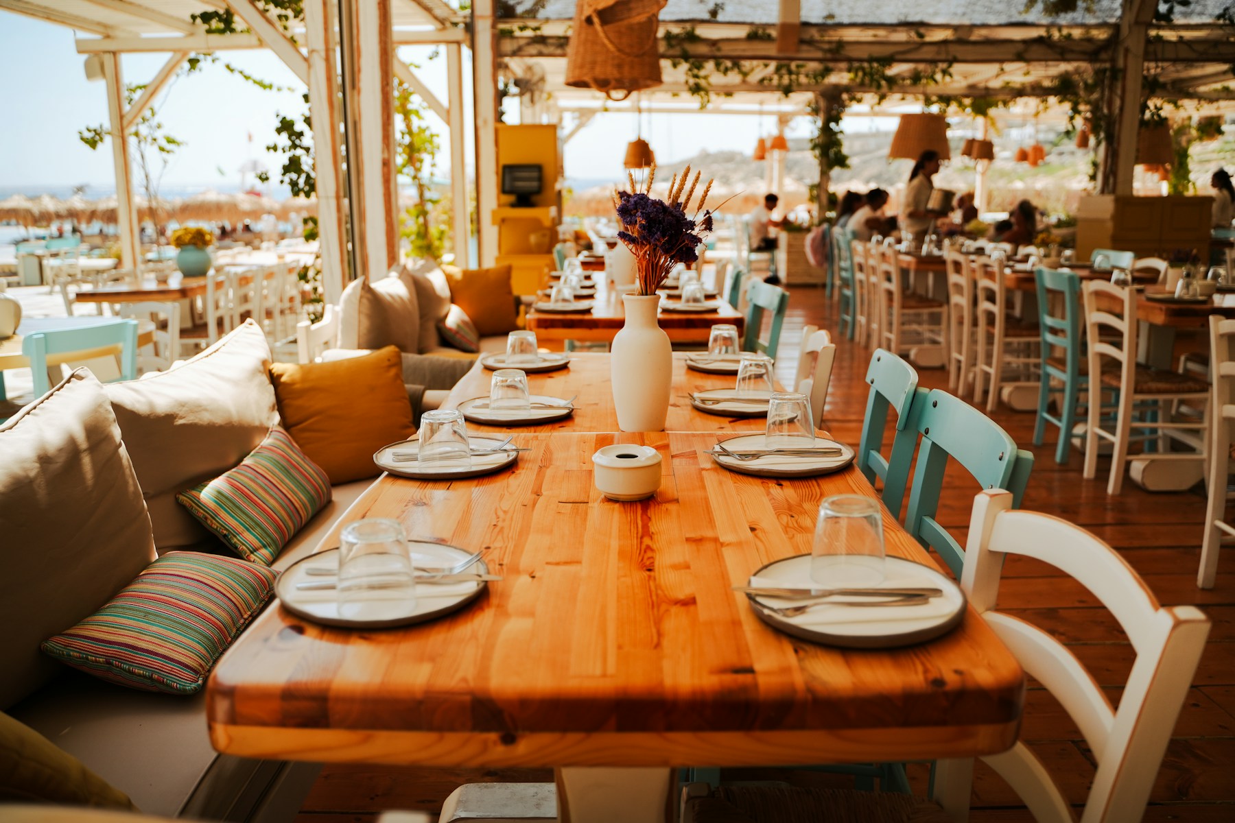 Warm seaside restaurant terrace ready for a holiday meal